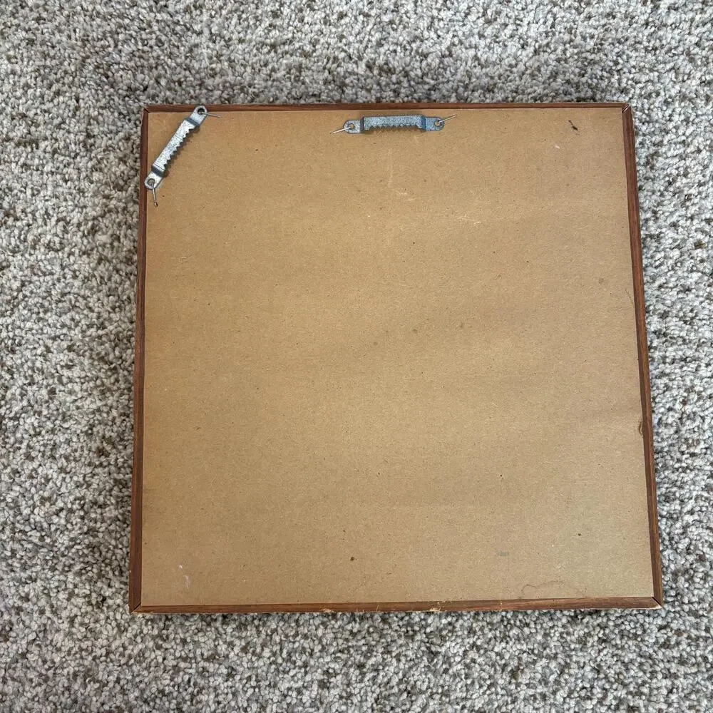 Vintage-style, square wall mirror features a thick, beveled solid wood frame